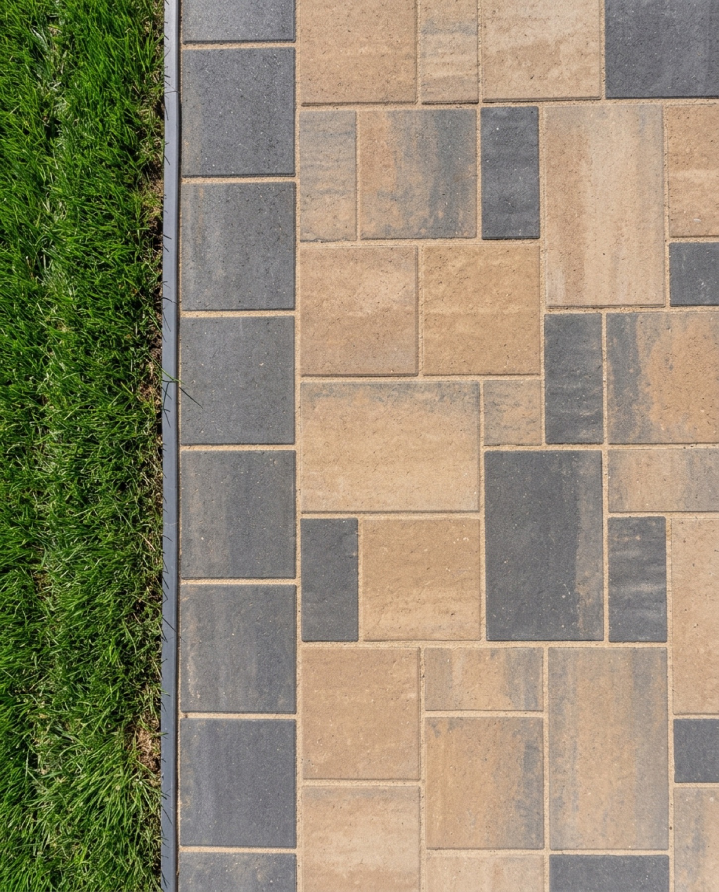 A newly-installed concrete paver patio